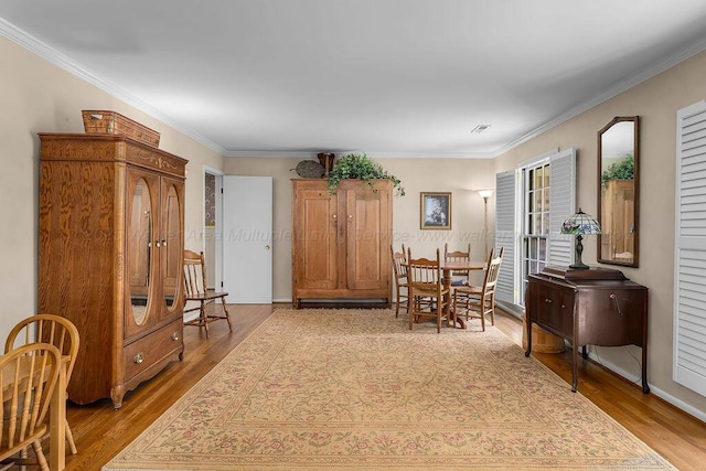 505 3rd Ave, Jasper, AL 35501 - dining area with light wood-style flooring and ornamental molding