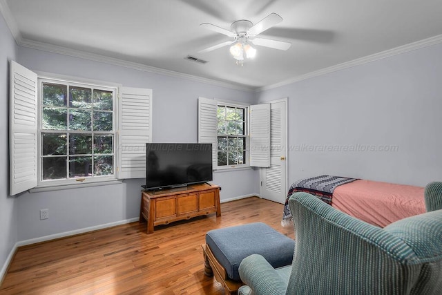 505 3rd Ave, Jasper, AL 35501 - living room featuring a ceiling fan, wood finished floors, and crown molding