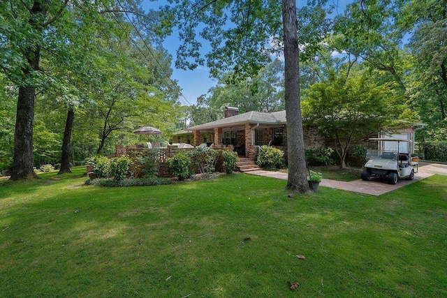 505 3rd Ave, Jasper, AL 35501 - view of front facade featuring a chimney, covered porch, and a front lawn