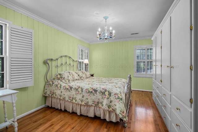 505 3rd Ave, Jasper, AL 35501 - bedroom featuring ornamental molding, a chandelier, and wood finished floors