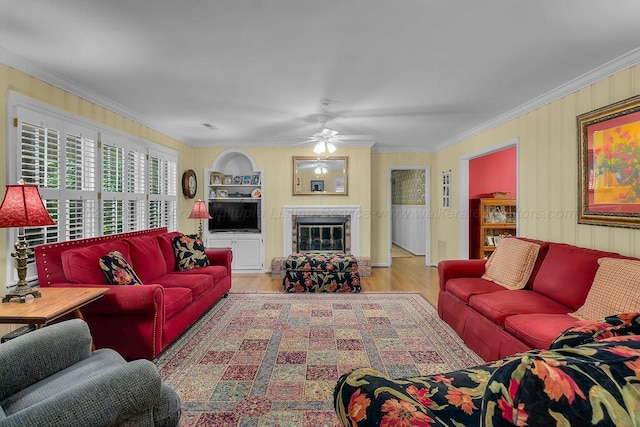 505 3rd Ave, Jasper, AL 35501 - living area featuring ornamental molding, wood finished floors, ceiling fan, and a fireplace