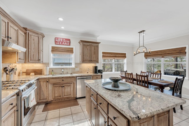 kitchen with light tile patterned floors, under cabinet range hood, decorative backsplash, a sink, and appliances with stainless steel finishes