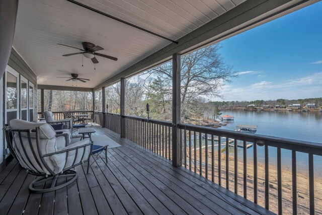 deck featuring a water view and ceiling fan