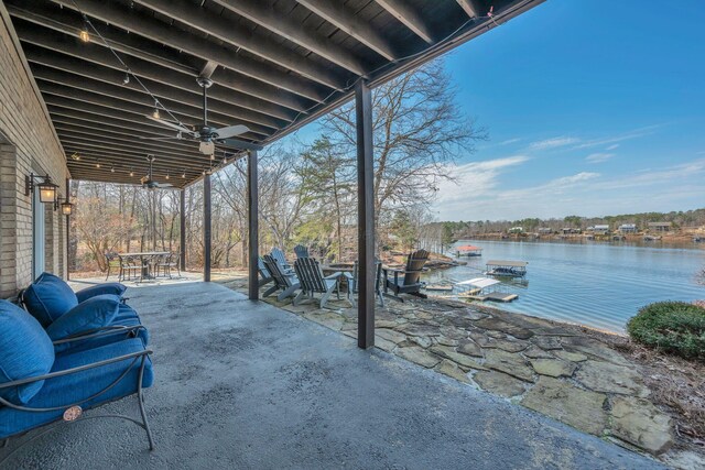 view of patio / terrace featuring outdoor dining space and a water view