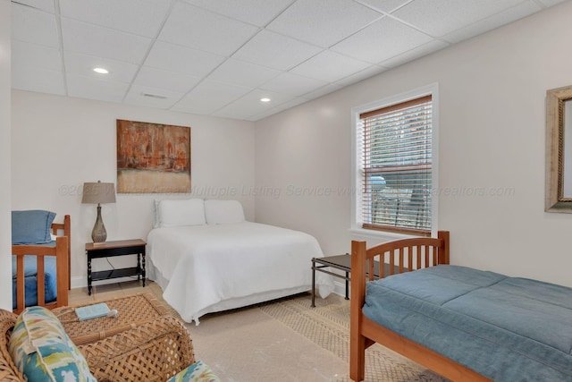bedroom with recessed lighting and a paneled ceiling