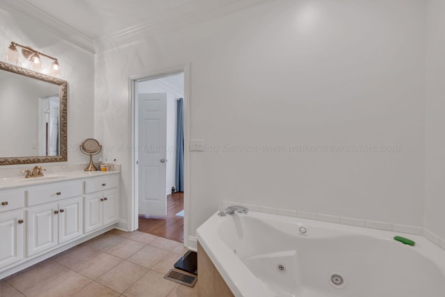 full bathroom with crown molding, a tub with jets, tile patterned floors, and vanity