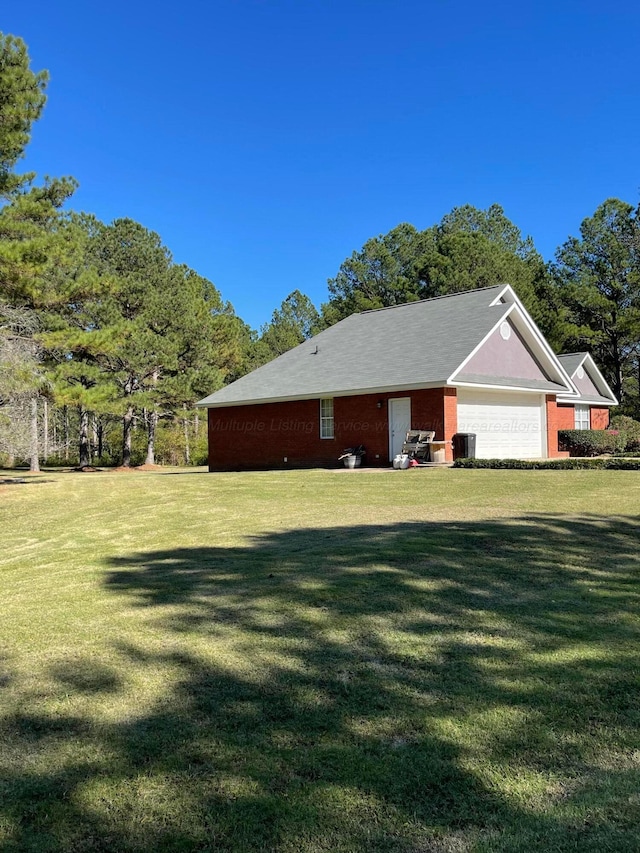 view of property exterior with a lawn, a garage, and cooling unit