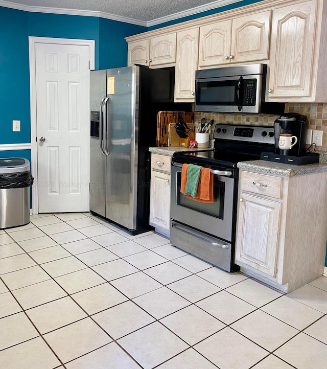 kitchen featuring appliances with stainless steel finishes, backsplash, a textured ceiling, ornamental molding, and light tile patterned floors