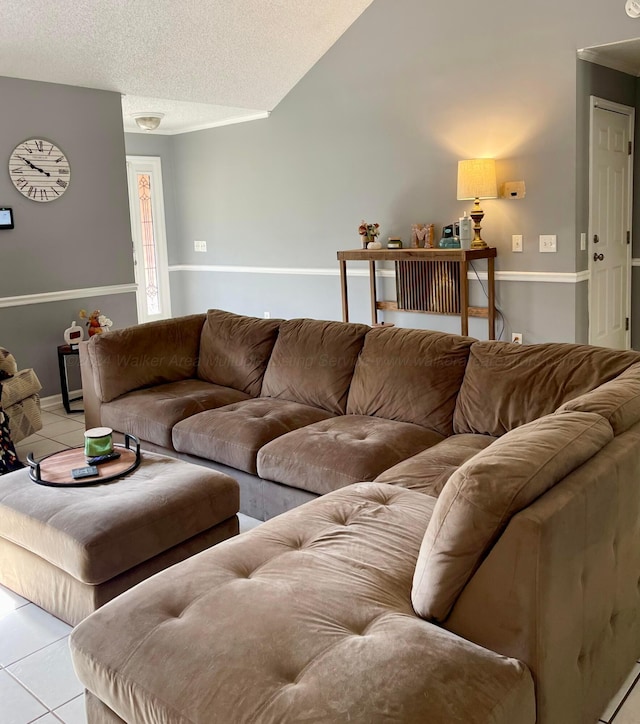 living room with light tile patterned floors and a textured ceiling