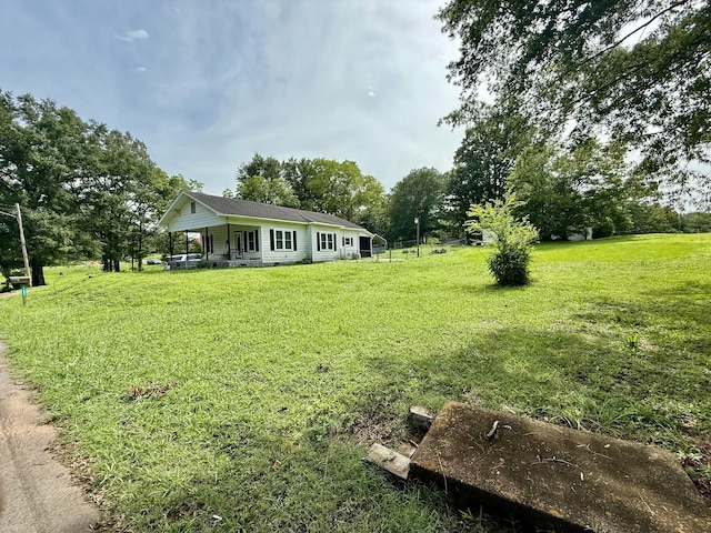 1902 Williams St, Jasper, AL 35501 - view of green lawn featuring covered porch