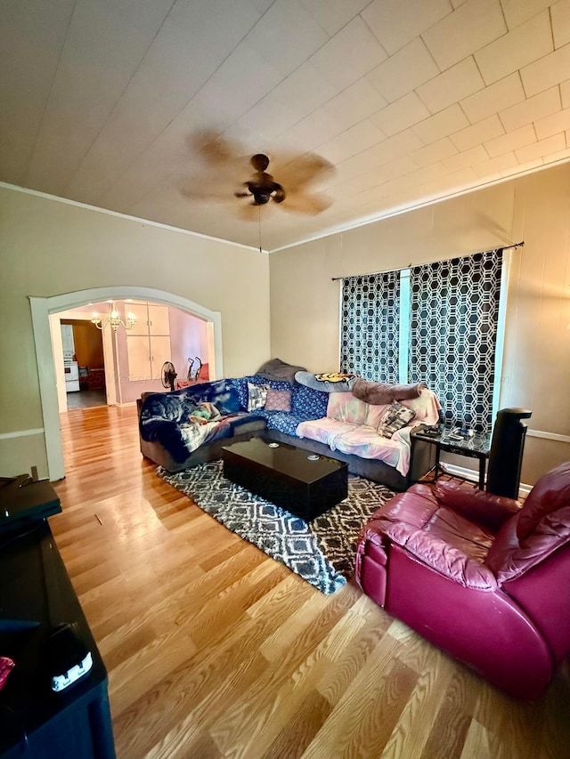 1902 Williams St, Jasper, AL 35501 - living area featuring arched walkways, wood finished floors, a ceiling fan, and ornamental molding