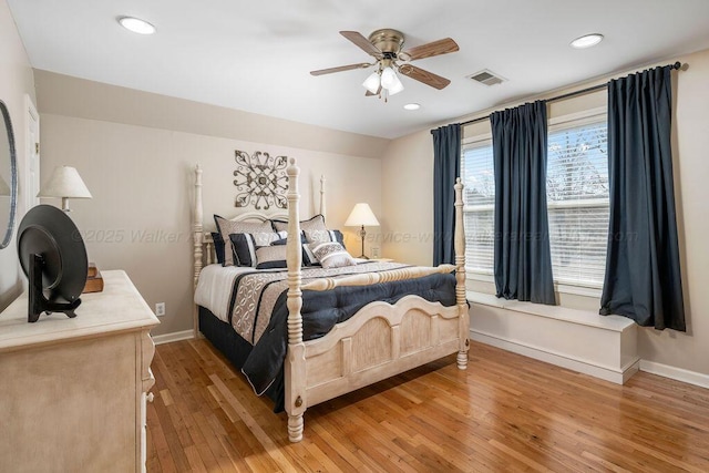 bedroom featuring light wood-style floors, baseboards, visible vents, and recessed lighting