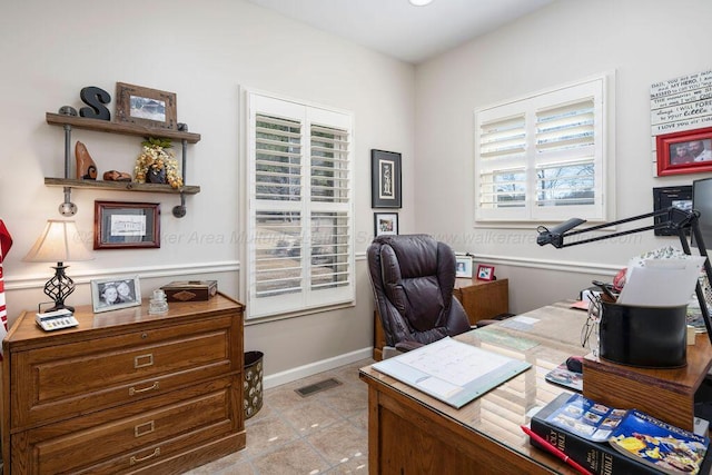 office featuring visible vents and baseboards