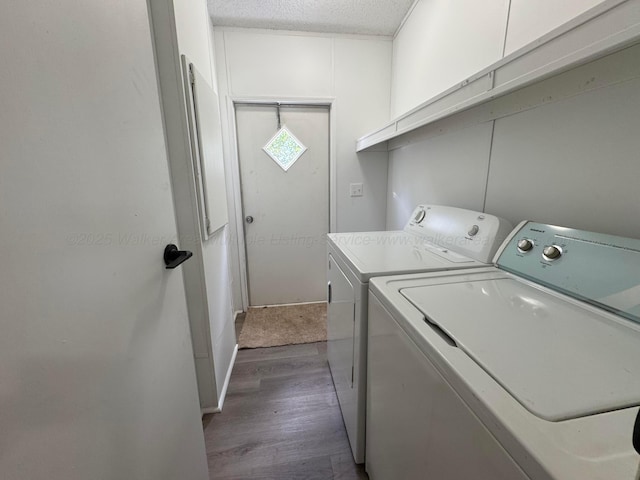 8502 Old Bagley Rd, Dora, AL 35062 - washroom with independent washer and dryer, wood finished floors, and a textured ceiling