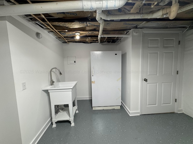 8502 Old Bagley Rd, Dora, AL 35062 - basement featuring baseboards and freestanding refrigerator