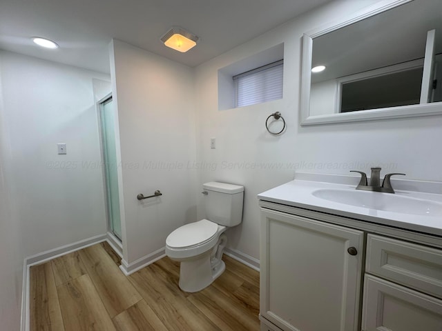 8502 Old Bagley Rd, Dora, AL 35062 - full bathroom featuring wood finished floors, vanity, a shower stall, and recessed lighting