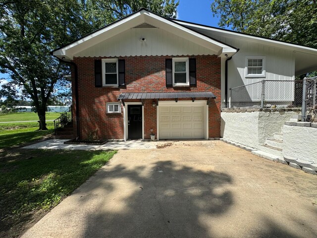 8502 Old Bagley Rd, Dora, AL 35062 - view of front of house featuring driveway, a garage, and brick siding