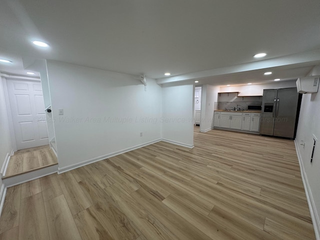 8502 Old Bagley Rd, Dora, AL 35062 - unfurnished living room featuring light wood-style flooring and recessed lighting