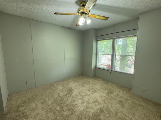 8502 Old Bagley Rd, Dora, AL 35062 - carpeted empty room with ceiling fan and a textured ceiling