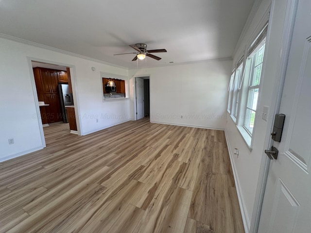 8502 Old Bagley Rd, Dora, AL 35062 - unfurnished living room with ceiling fan, light wood-type flooring, and ornamental molding
