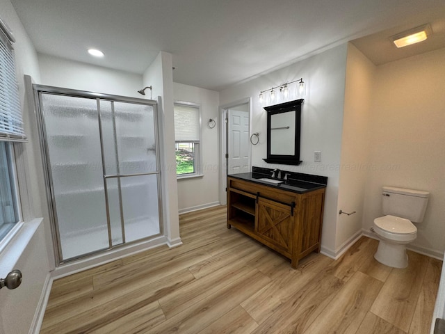 8502 Old Bagley Rd, Dora, AL 35062 - bathroom featuring vanity, wood finished floors, a stall shower, and recessed lighting