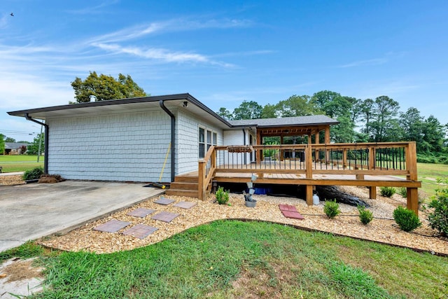 back of house featuring a deck