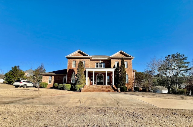 view of front of house with brick siding