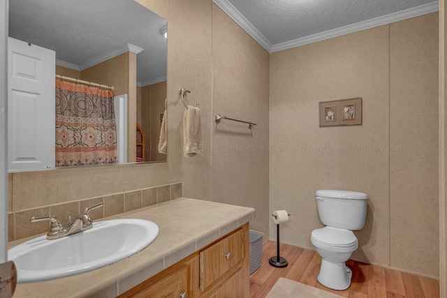 full bath featuring toilet, a textured ceiling, wood finished floors, and vanity