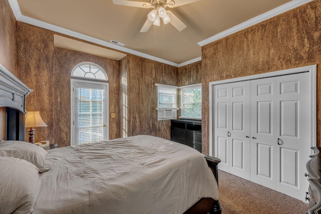 bedroom with visible vents, carpet flooring, crown molding, and multiple windows