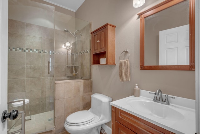full bathroom featuring vanity, toilet, and a shower stall