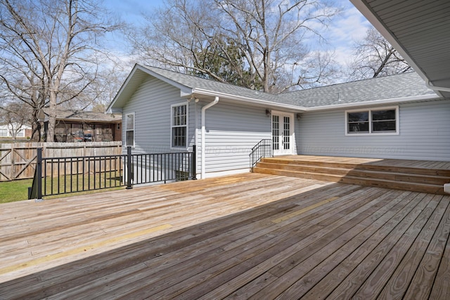 wooden deck featuring french doors and fence