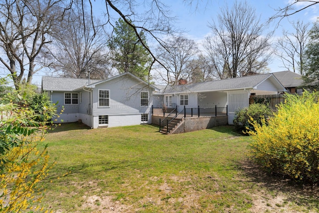 rear view of property with stairs, a chimney, and a yard