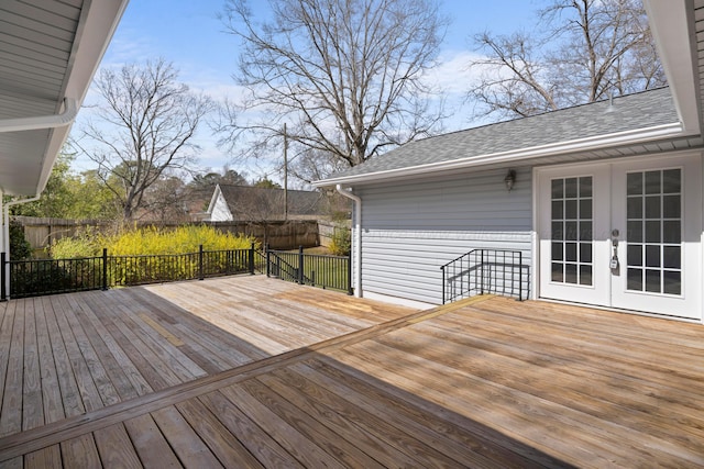 deck featuring fence and french doors