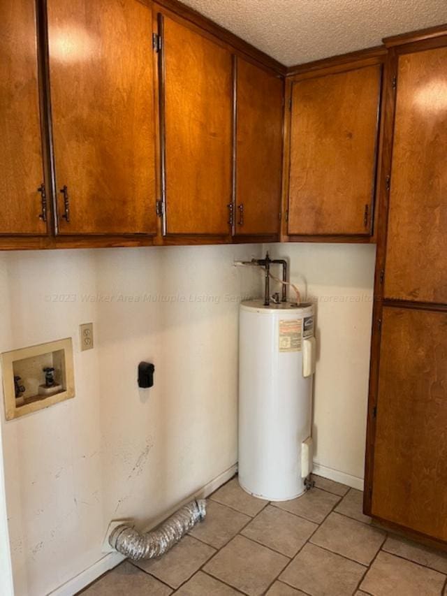 116 Royal Loop, Winfield, AL 35594 - laundry area with a textured ceiling, washer hookup, water heater, hookup for an electric dryer, and cabinet space