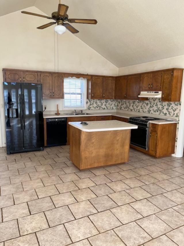 116 Royal Loop, Winfield, AL 35594 - kitchen with light countertops, a kitchen island, a ceiling fan, under cabinet range hood, and black appliances