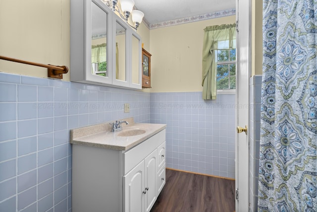 1768 Pineywoods Sipsey Rd, Jasper, AL 35504 - bathroom with tile walls, vanity, wood finished floors, wainscoting, and curtained shower