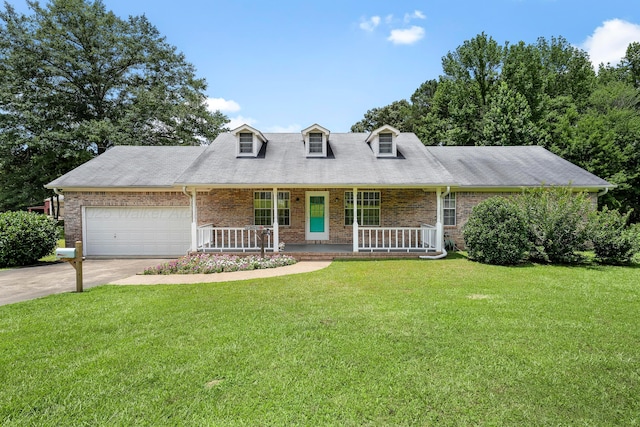 1768 Pineywoods Sipsey Rd, Jasper, AL 35504 - cape cod home featuring covered porch, brick siding, a front lawn, and driveway