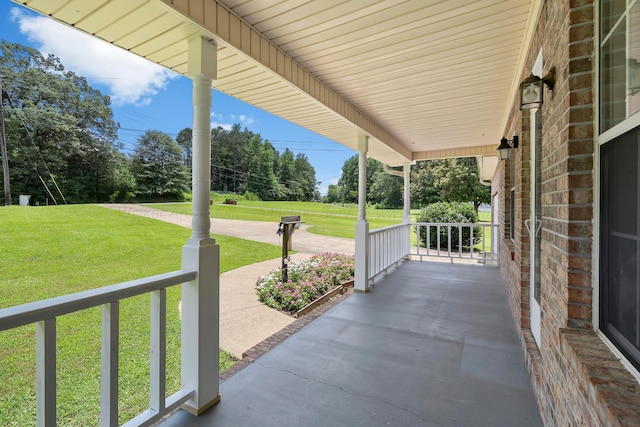 1768 Pineywoods Sipsey Rd, Jasper, AL 35504 - covered porch featuring a lawn and view of wooded area