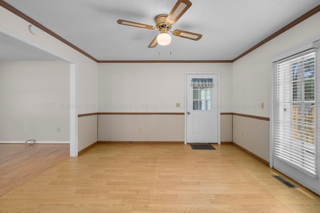 1768 Pineywoods Sipsey Rd, Jasper, AL 35504 - unfurnished room featuring plenty of natural light, light wood-type flooring, crown molding, ceiling fan, and a textured ceiling