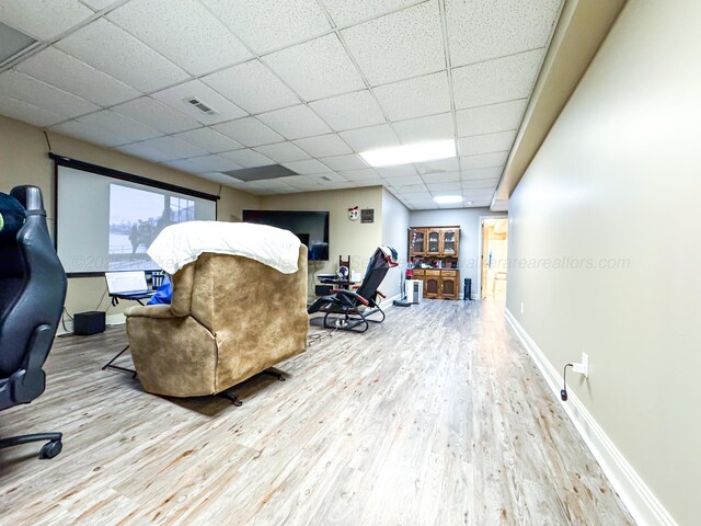 1000 Foothill Rd, Winfield, AL 35594 - living area with wood finished floors, a drop ceiling, and baseboards