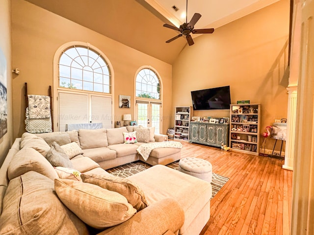 1000 Foothill Rd, Winfield, AL 35594 - living area with high vaulted ceiling, a ceiling fan, and hardwood / wood-style flooring