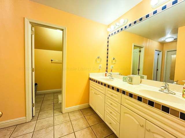 1000 Foothill Rd, Winfield, AL 35594 - bathroom featuring tile patterned floors, double vanity, and baseboards