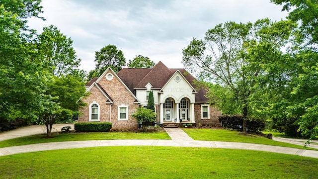 1000 Foothill Rd, Winfield, AL 35594 - french country style house with a front yard and brick siding