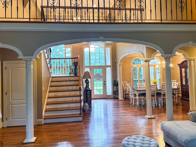 1000 Foothill Rd, Winfield, AL 35594 - foyer featuring a high ceiling, ornate columns, wood finished floors, and arched walkways