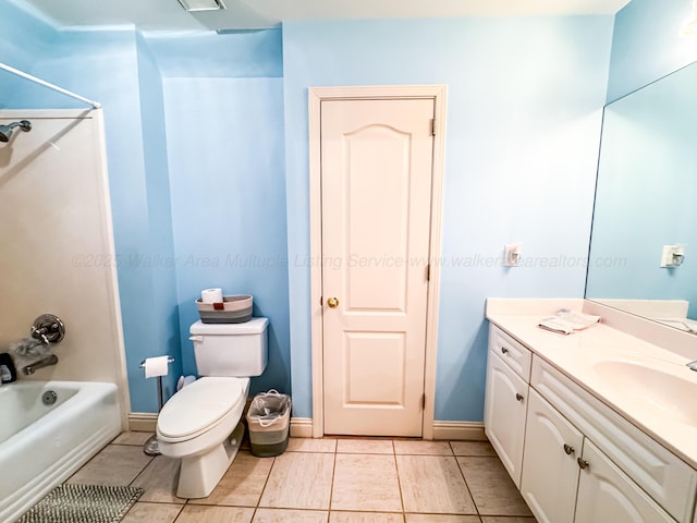 1000 Foothill Rd, Winfield, AL 35594 - full bathroom featuring shower / washtub combination, vanity, toilet, tile patterned floors, and baseboards