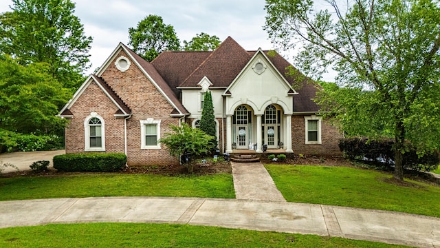 1000 Foothill Rd, Winfield, AL 35594 - view of front facade with a front lawn, brick siding, and stucco siding