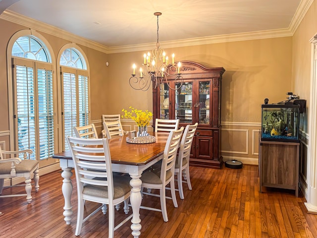 1000 Foothill Rd, Winfield, AL 35594 - dining area featuring dark wood-style flooring, a chandelier, crown molding, a decorative wall, and wainscoting