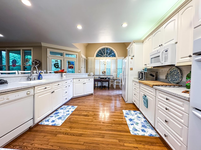 1000 Foothill Rd, Winfield, AL 35594 - kitchen featuring white appliances, a sink, light countertops, white cabinetry, and recessed lighting