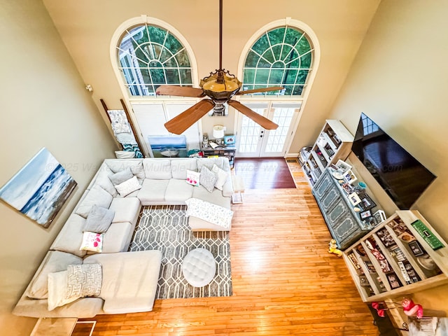 1000 Foothill Rd, Winfield, AL 35594 - living room with hardwood / wood-style flooring, a ceiling fan, and a high ceiling