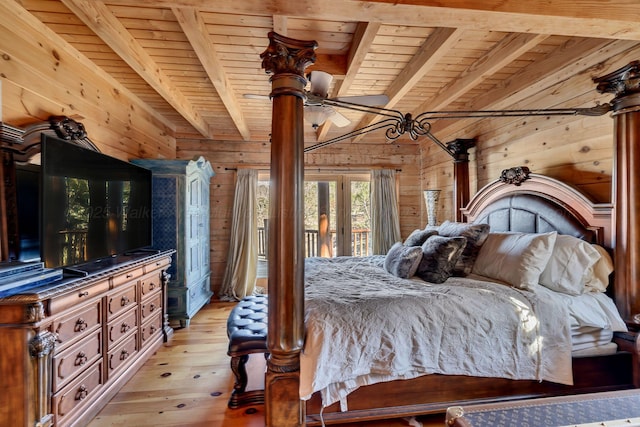 bedroom featuring light wood finished floors, beam ceiling, access to exterior, wood ceiling, and wooden walls